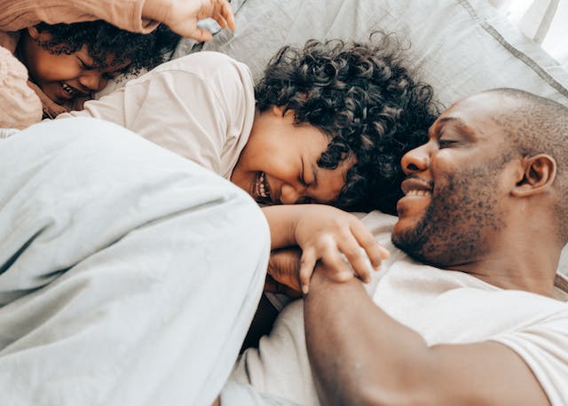 dad laughing with kids